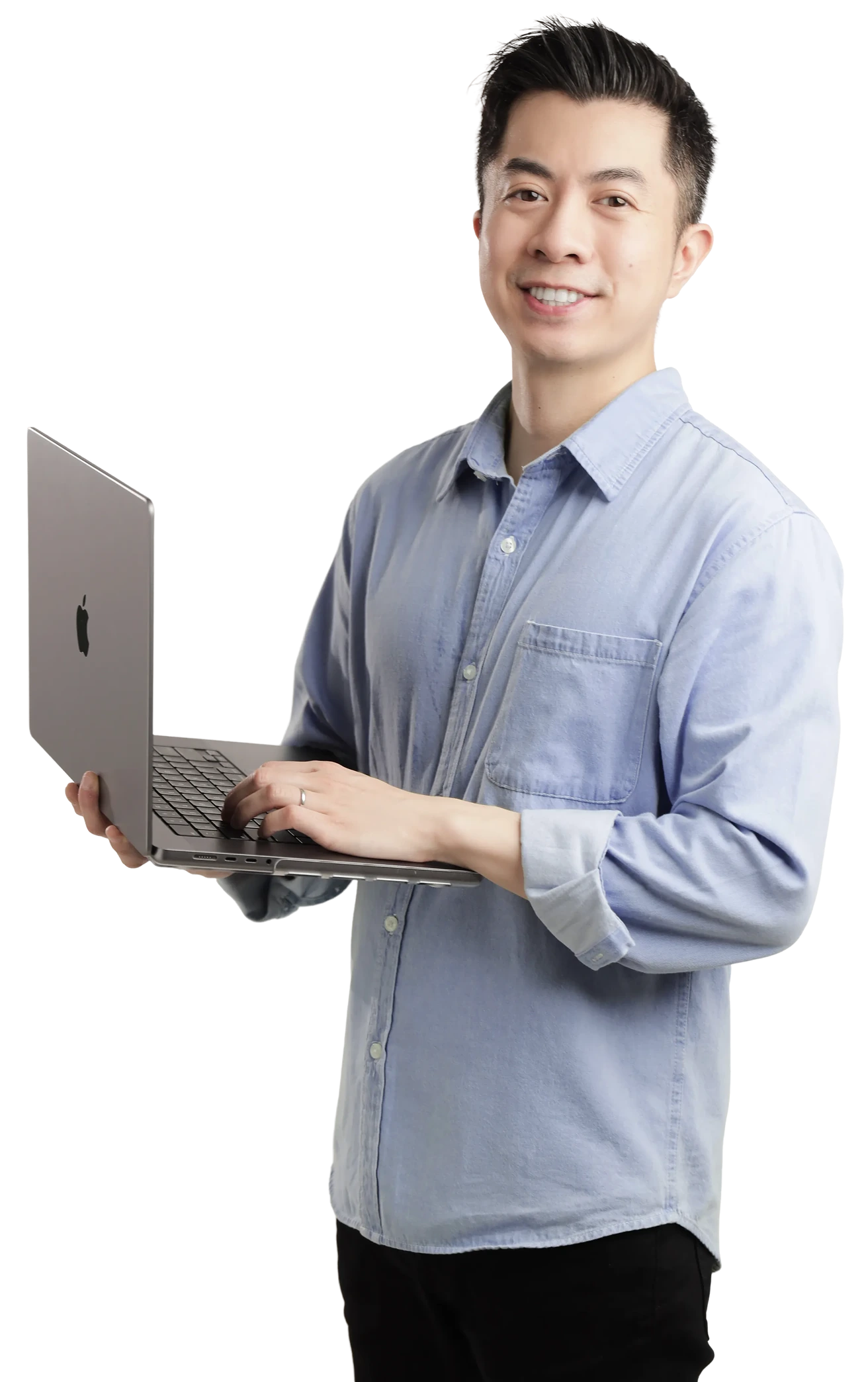 Brendan Ho, founder of SaaS Designer, holding a laptop